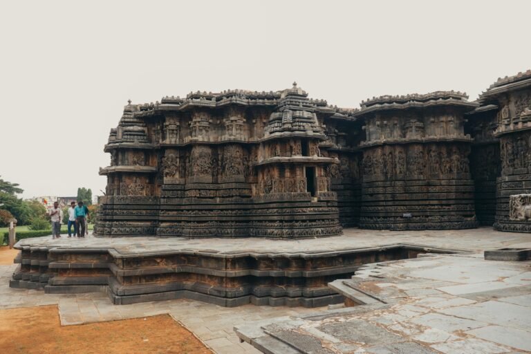 Explore the stunning stone carvings of Hoysaleshwara Temple, a famous Indian landmark and travel destination.